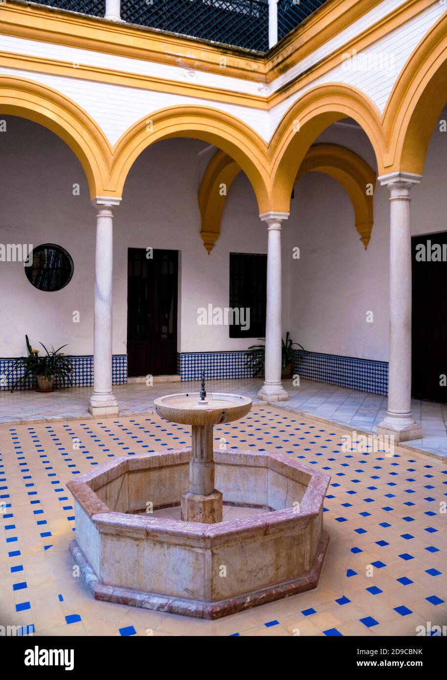 Courtyard of the Alcázar in Seville Moorish style fountain and Romanesque arches, Spain. Stock Photo