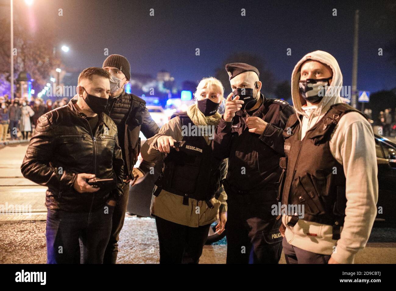 A group of policeman and police negotiators discussing a possible route of the protest.  The Polish Constitutional Court in its new, politically chose Stock Photo