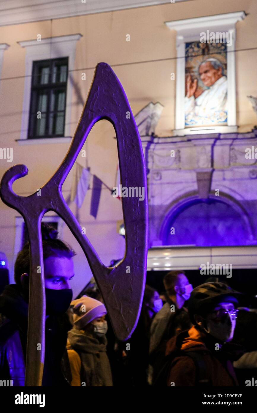 An axe-like hanger seen as protesters pass by the famous 'papal window' in the curia building, from which Pope John Paul II gave many speeches to Pole Stock Photo