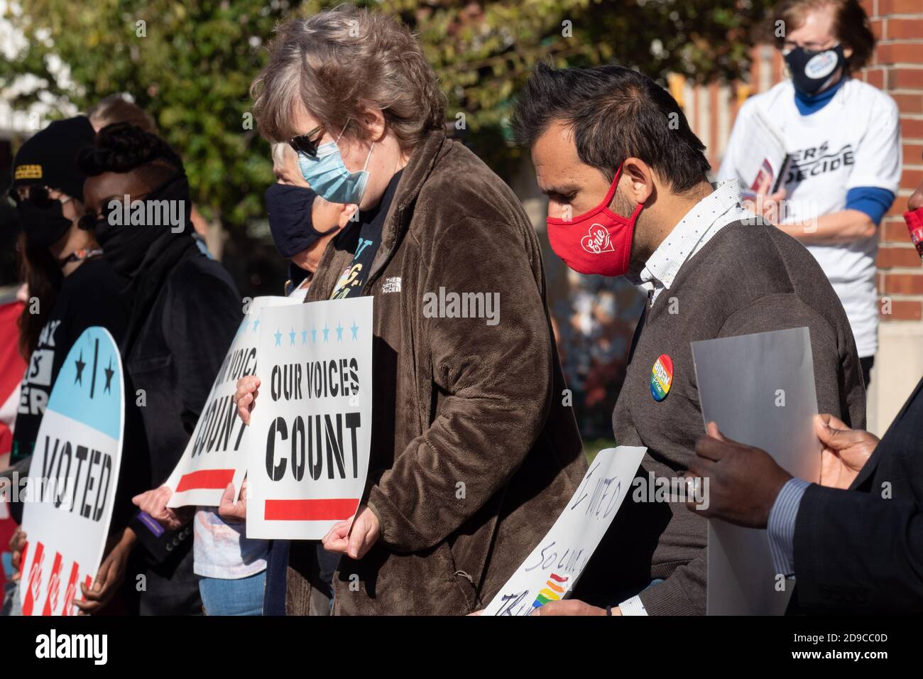 Protesters holding placards expressing their opinion during the demonstration.Dozens gather in Erie, Pennsylvania's Perry Square Park to demand that their votes be counted in the still contested 2020 presidential election. The inordinately high number of absentee ballots and early votes means that Pennsylvania, a key battleground state--may be counting votes until Friday. Stock Photo