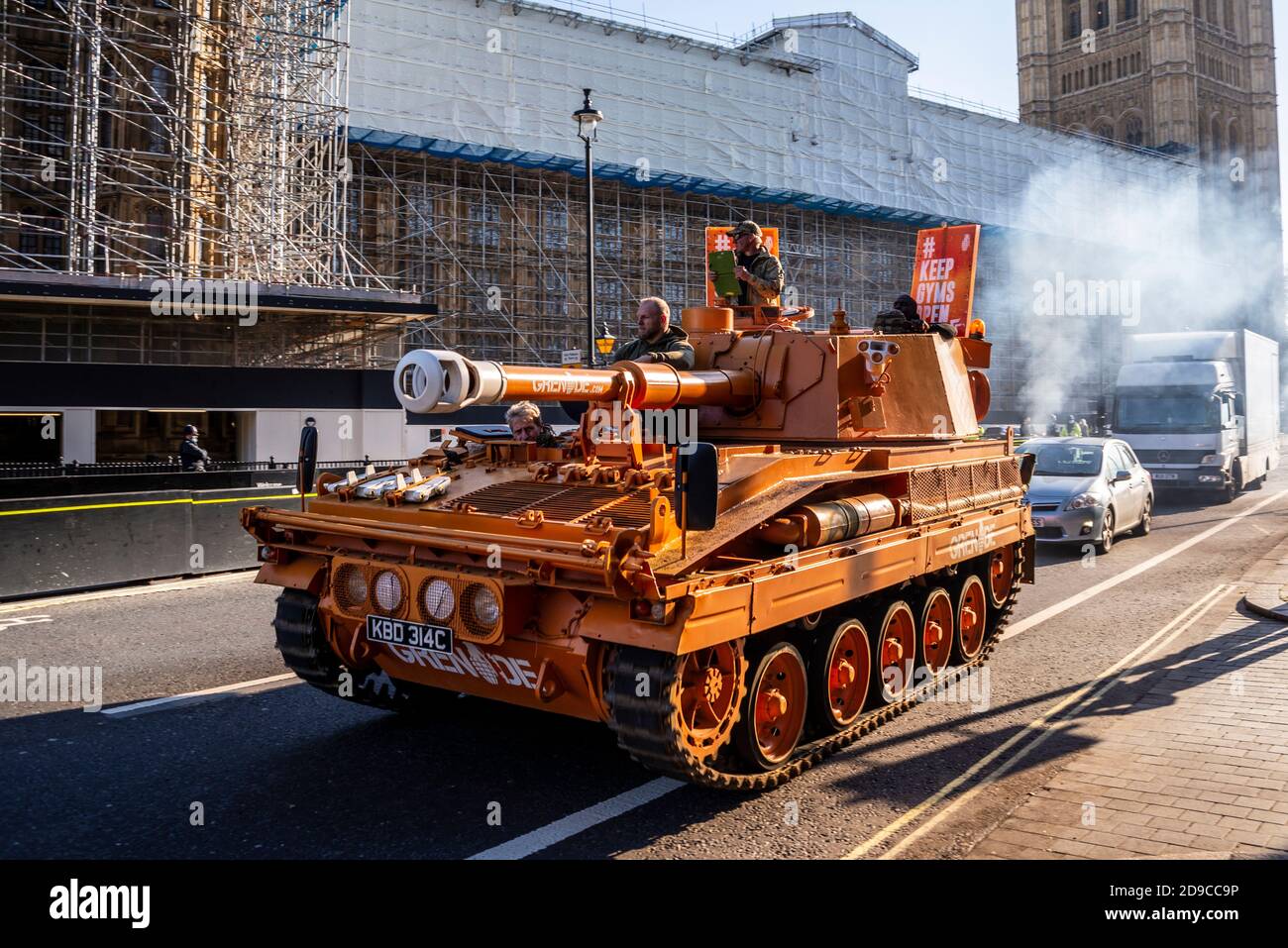A tank, self propelled gun, driving around Westminster and Parliament in protest at the closure of gyms during the COVID-19 lockdown. Smoky exhaust Stock Photo