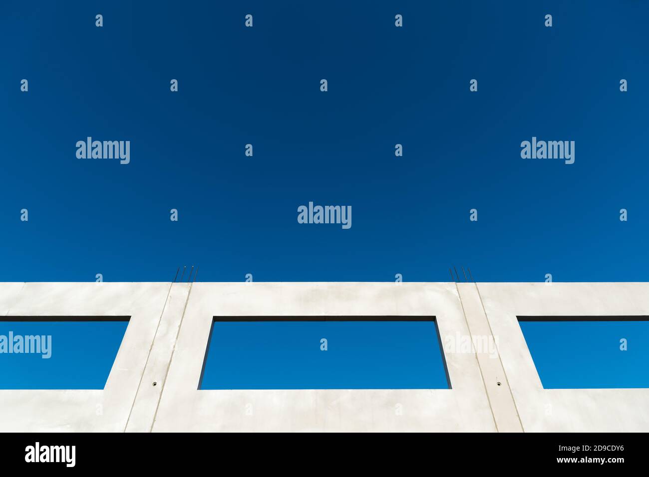 Window of a building shell with blue sky Stock Photo - Alamy