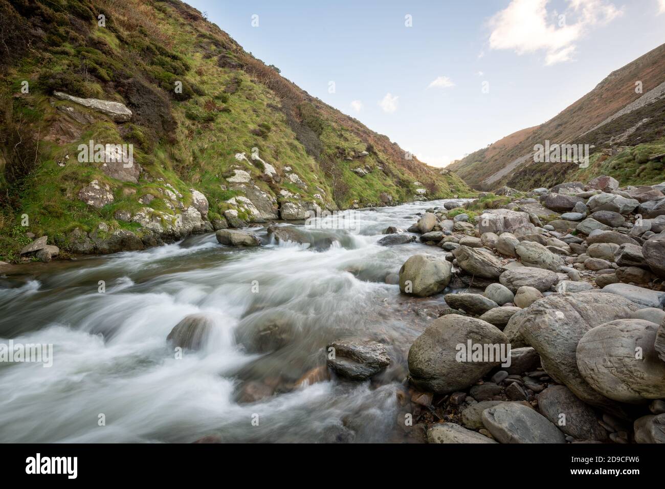 Long exposure of the river Heddon flowing through the Heddon valley at Heddons Mouth in Exmoor Stock Photo