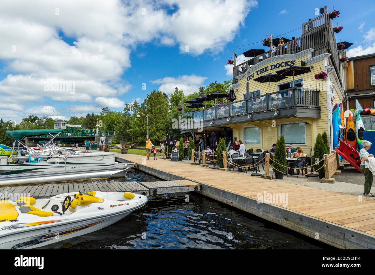 The Town Docks and busnesses along the Muskoka River in Huntsville, Ontario. Stock Photo