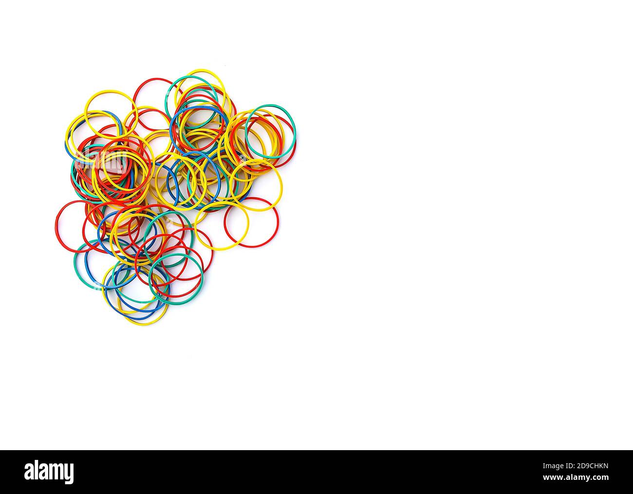Bright colorful rubber bands on white background Stock Photo - Alamy