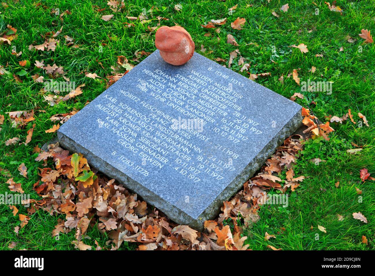 World War I headstone with clay figure at Langemark German war cemetery in Langemark-Poelkapelle, Belgium Stock Photo