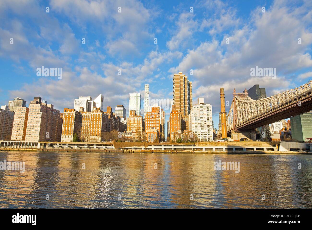 New York City skyline in the morning with sun beaming into windows of Manhattan buildings, USA. Stock Photo
