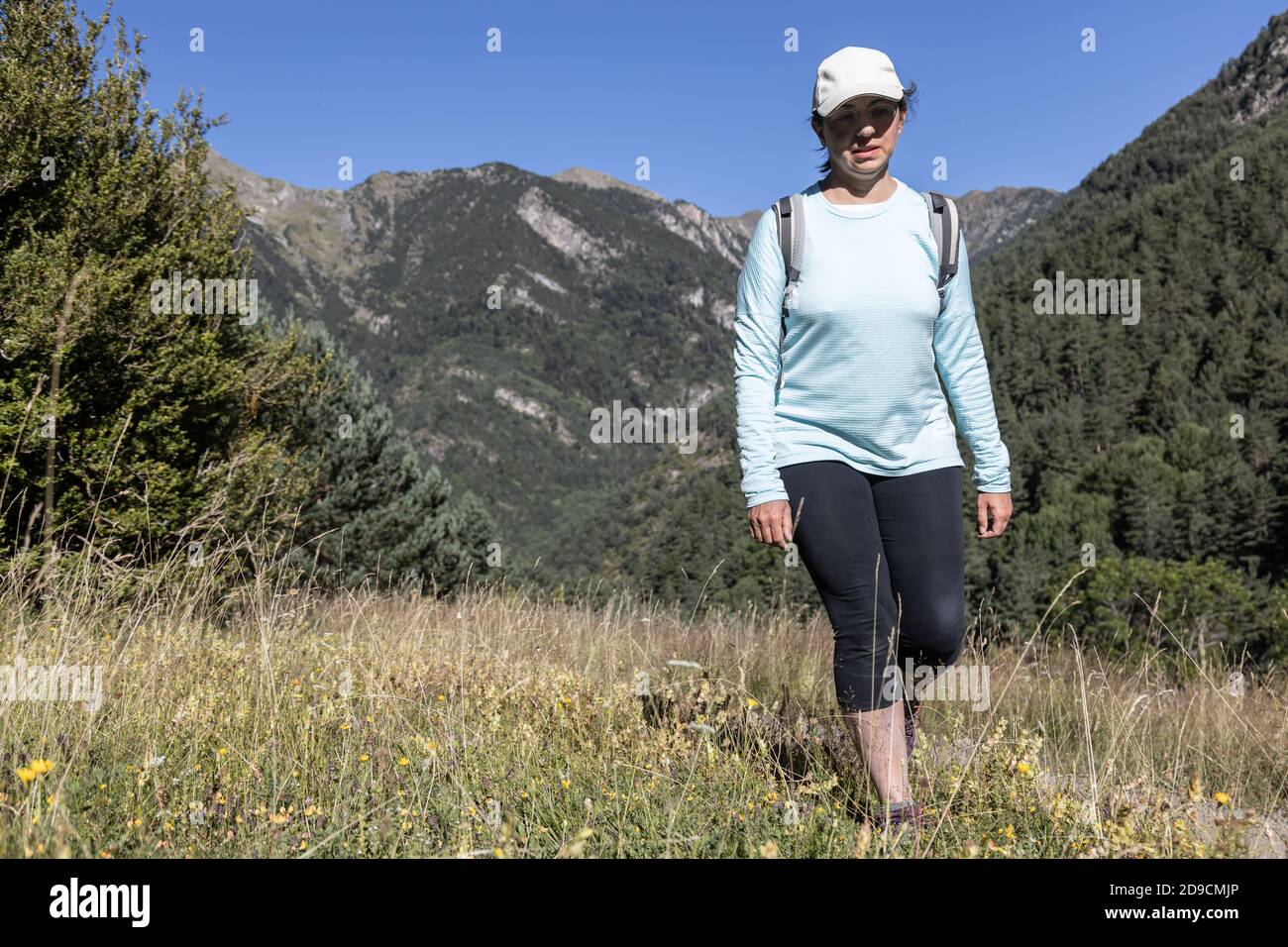 Young tourist woman walking on the Spanish Pyrenees mountain Stock Photo