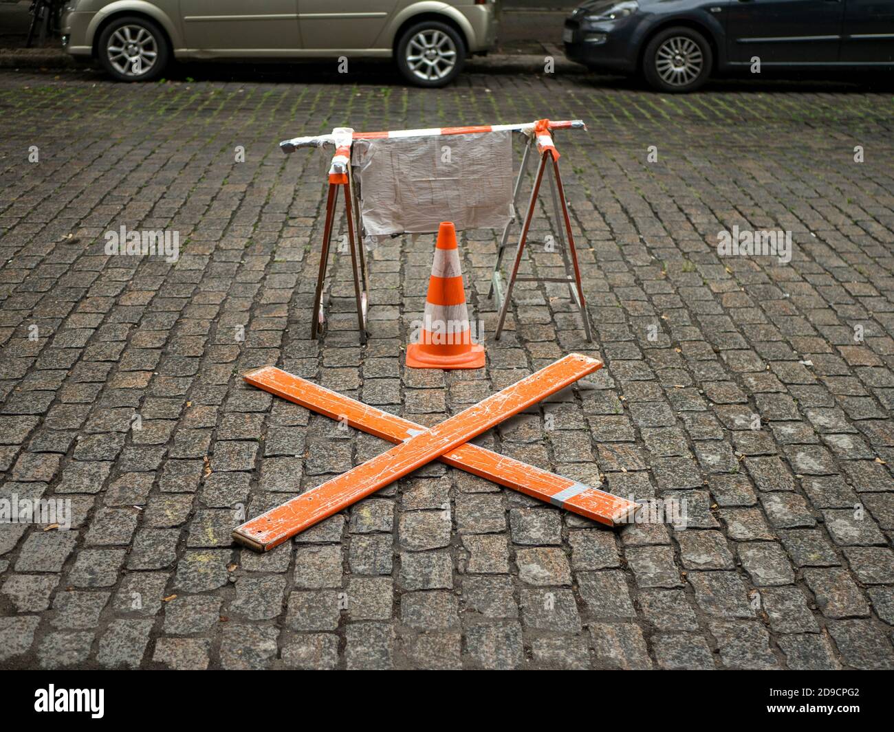 makeshift no parking structure set out on a cobbled street Stock Photo