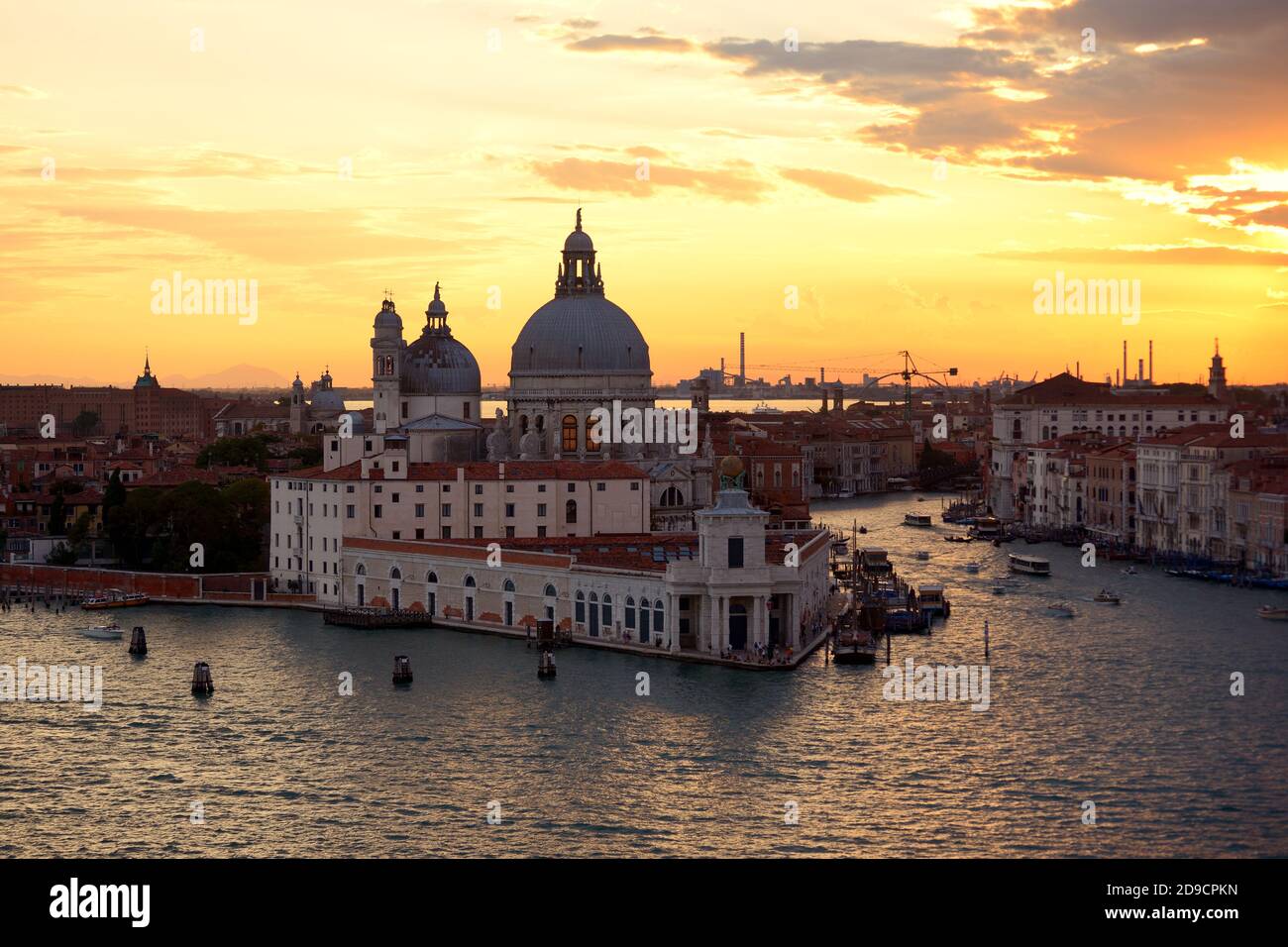 Basilica di Santa Maria della Salute and the Grand Canal at sunset, Venice Stock Photo