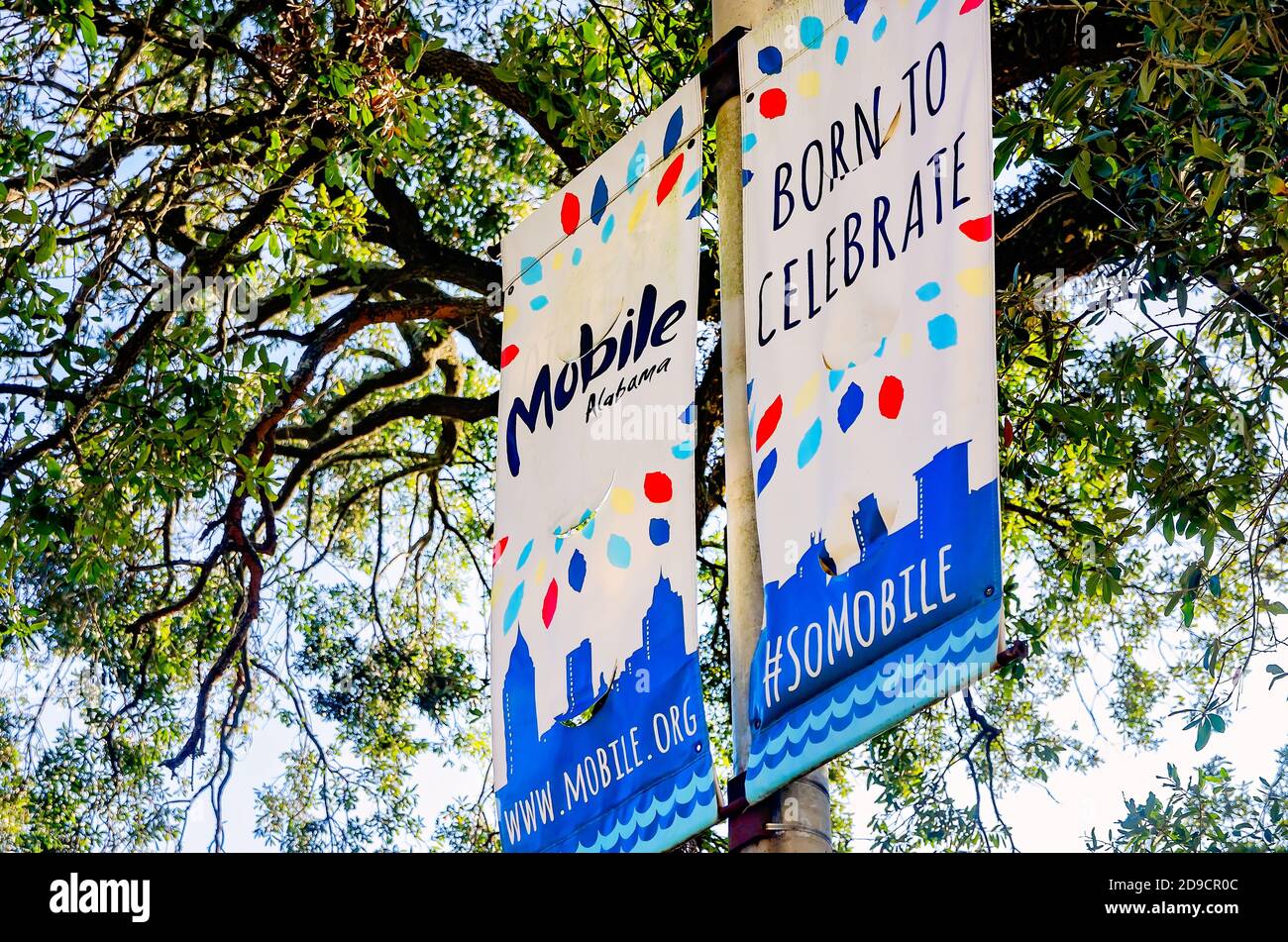 Tourism banners hang on a lamp post on Government Street, Oct. 31, 2020, in Mobile, Alabama. Stock Photo