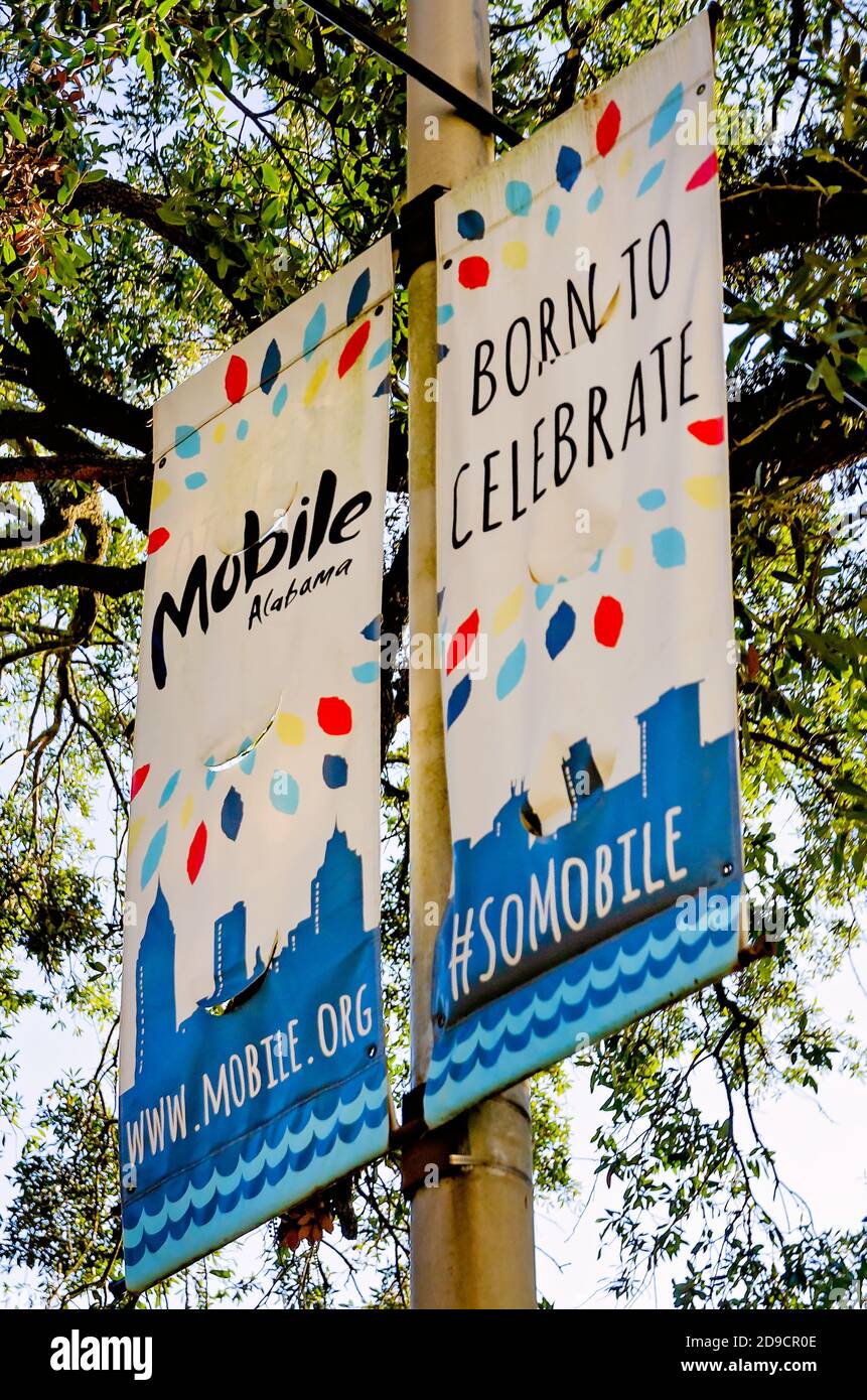 Tourism banners hang on a lamp post on Government Street, Oct. 31, 2020, in Mobile, Alabama. Stock Photo
