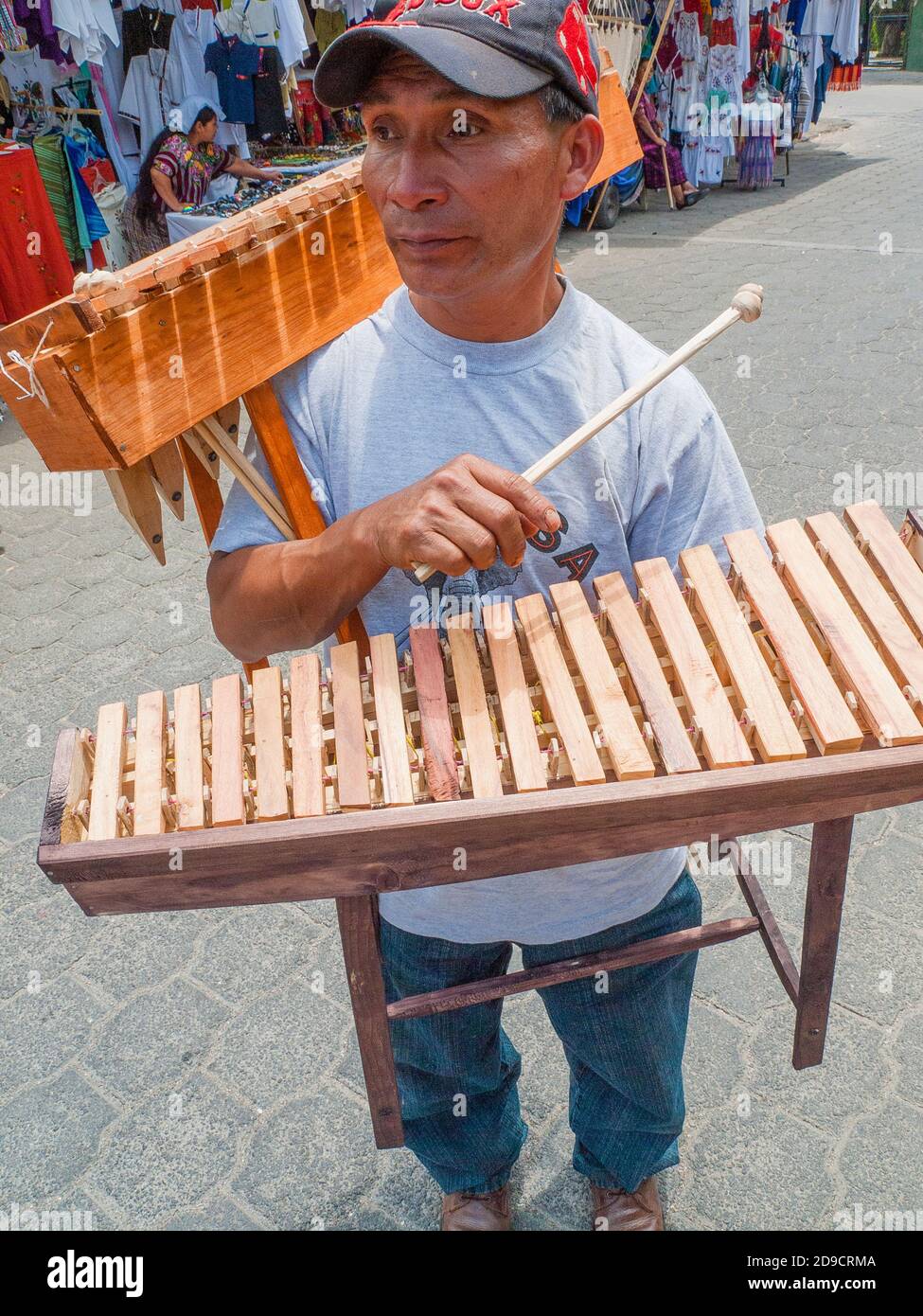 A vendor selling marimbas on the street in Panajachel, Guatemala Stock