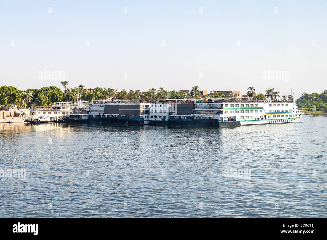 A lot of Floating hotels (tourist boats) moored between Luxor and Aswan in central Egypt for lack of tourism Stock Photo
