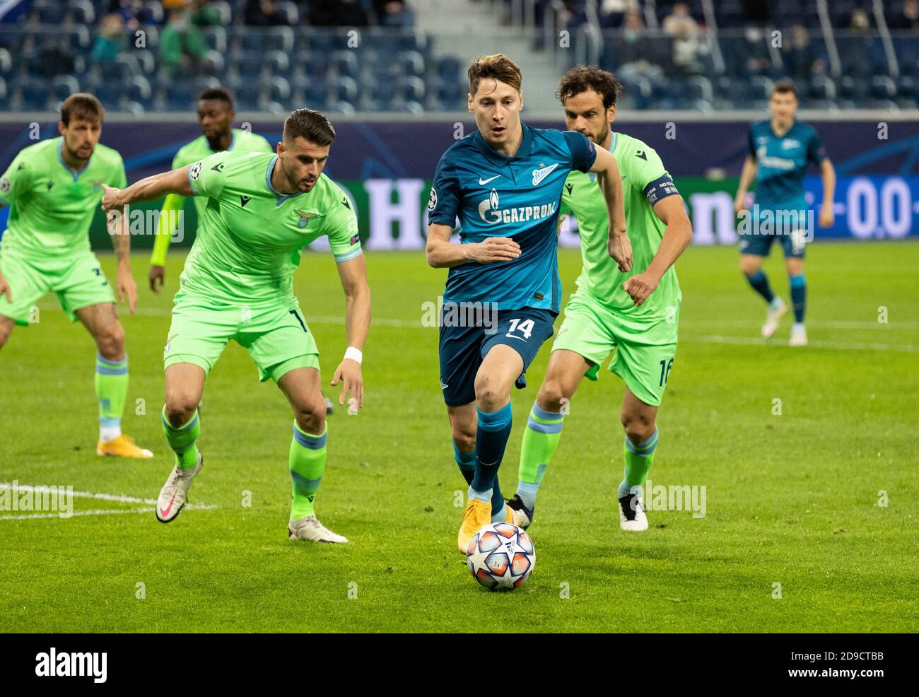 SAINT PETERSBURG, RUSSIA - NOVEMBER 04: Daler Kuzyayev of Zenit St Petersburg is surrounded by Joaquín Correa & Marco Parolo of SS Lazio during the UEFA Champions League Group F stage match between Zenit St. Petersburg and SS Lazio at Gazprom Arena on November 4, 2020 in Saint Petersburg, Russia. (Photo by MB Media) Stock Photo