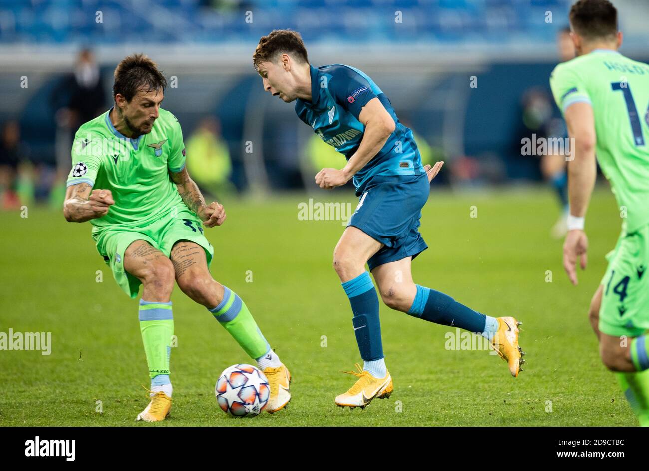 SAINT PETERSBURG, RUSSIA - NOVEMBER 04: Daler Kuzyayev of Zenit St Petersburg beats Franceso Acerbi of SS Lazio during the UEFA Champions League Group F stage match between Zenit St. Petersburg and SS Lazio at Gazprom Arena on November 4, 2020 in Saint Petersburg, Russia. (Photo by MB Media) Stock Photo