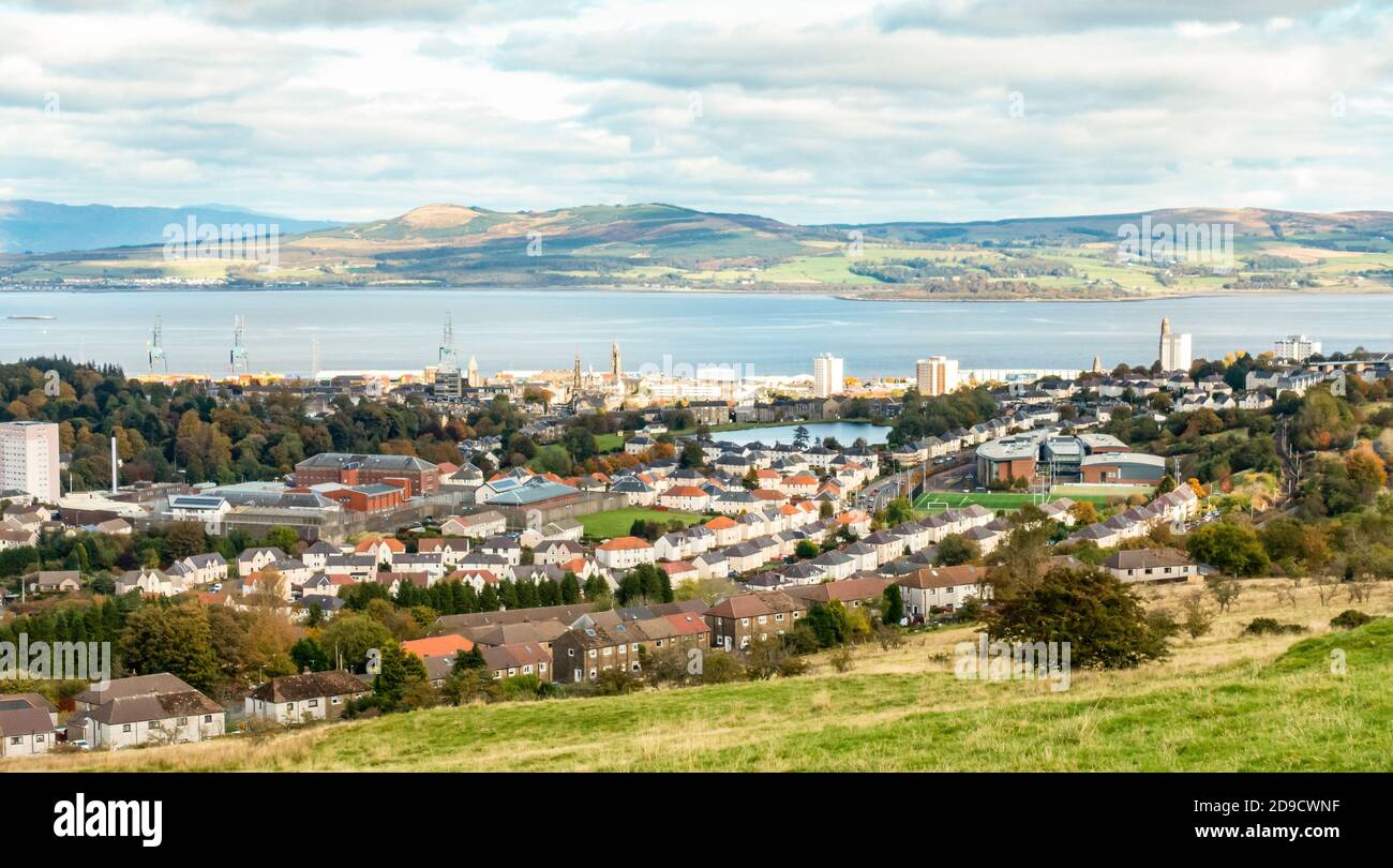 Elevated view of Greenock, Inverclyde, Scotland showing HMP Greenock, and Cowdenowes reservoir. Looking north over the Firth of Clyde to Argyll Stock Photo