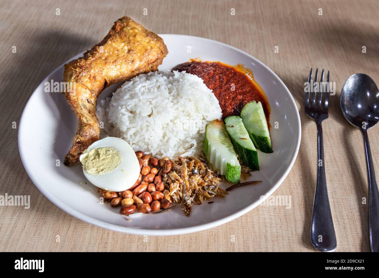 Simple nasi lemak with sambal fried chicken, popular in Malaysia Stock Photo