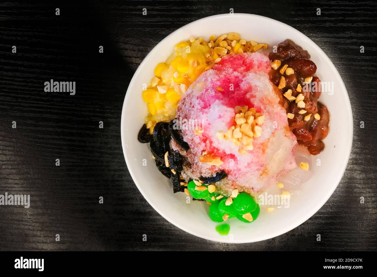 Ice kacang, shaved ice desert with milk , syrup, beans, corn Stock Photo