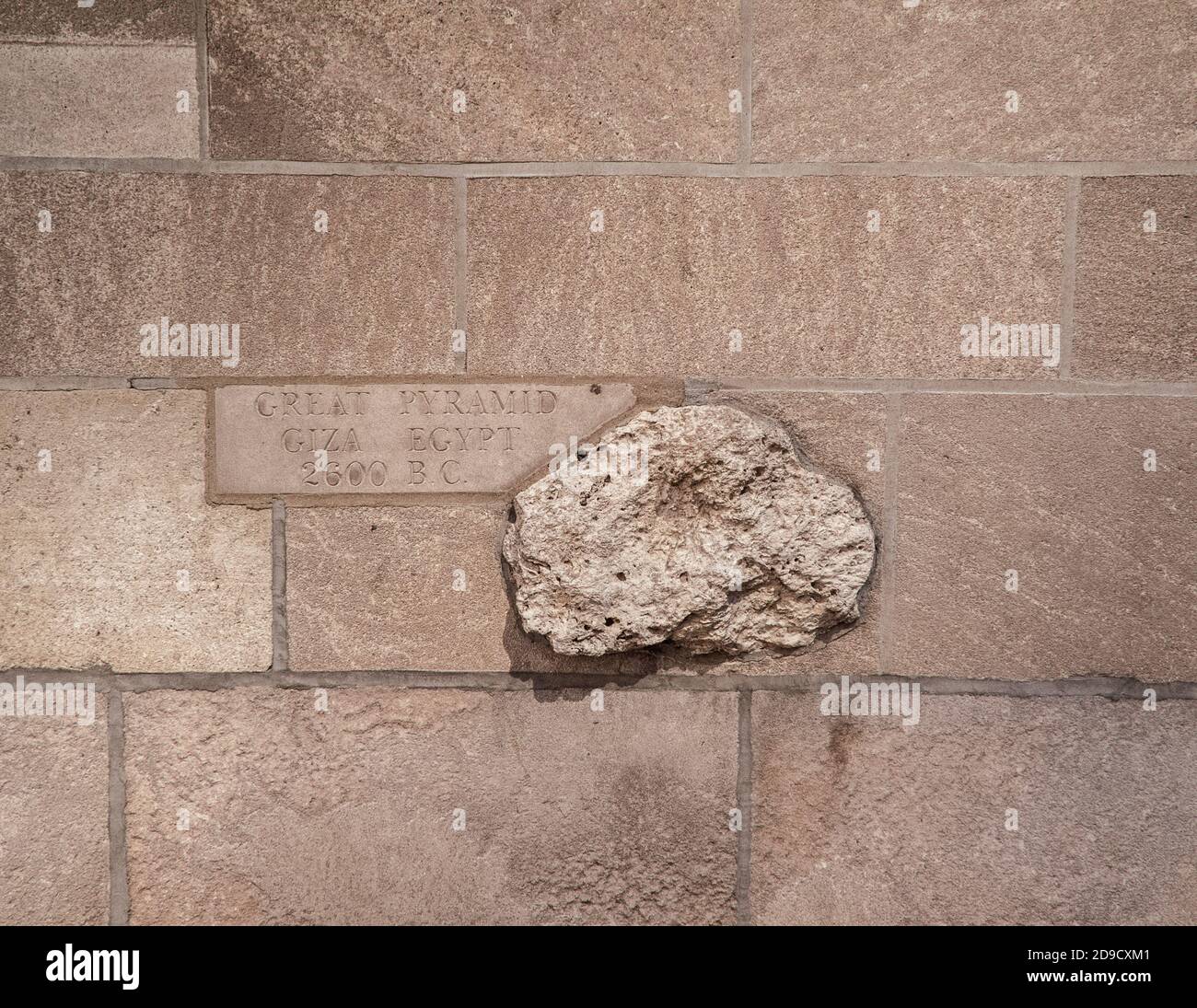 Rock from the Great Pyramid of Giza, Egypt encrusted into the wall of the Tribune Tower Building in Chicago, Illinois, USA Stock Photo