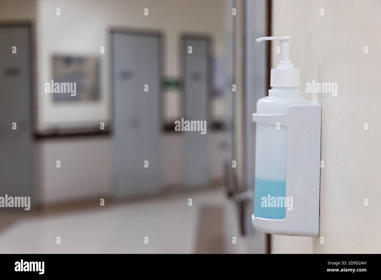 Public hand disinfectant sanitizer dispenser available in hospital for hygiene Stock Photo