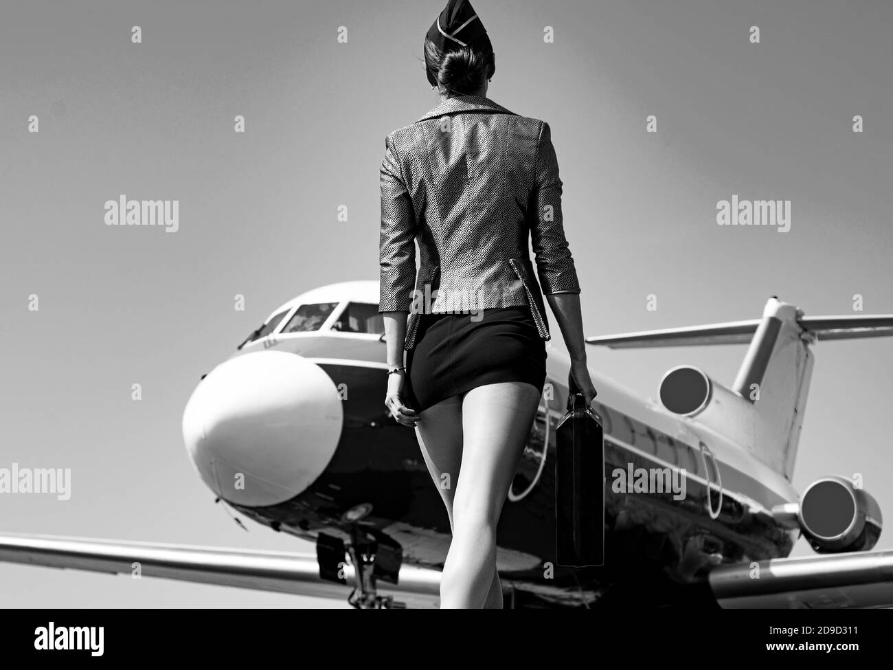 Profession stewardess. Air hostess. Female flight attendant. Air stewardess. Travel concept. Commercial airplane flying with beautiful charming Stock Photo - Alamy Profession stewardess. Air hostess. Female flight attendant. Air stewardess. Travel concept. Commercial airplane flying with beautiful charming Stock Photo - Alamy