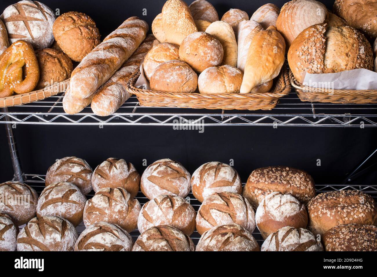 A assortment of different types of artisan bread displayed at a bakery