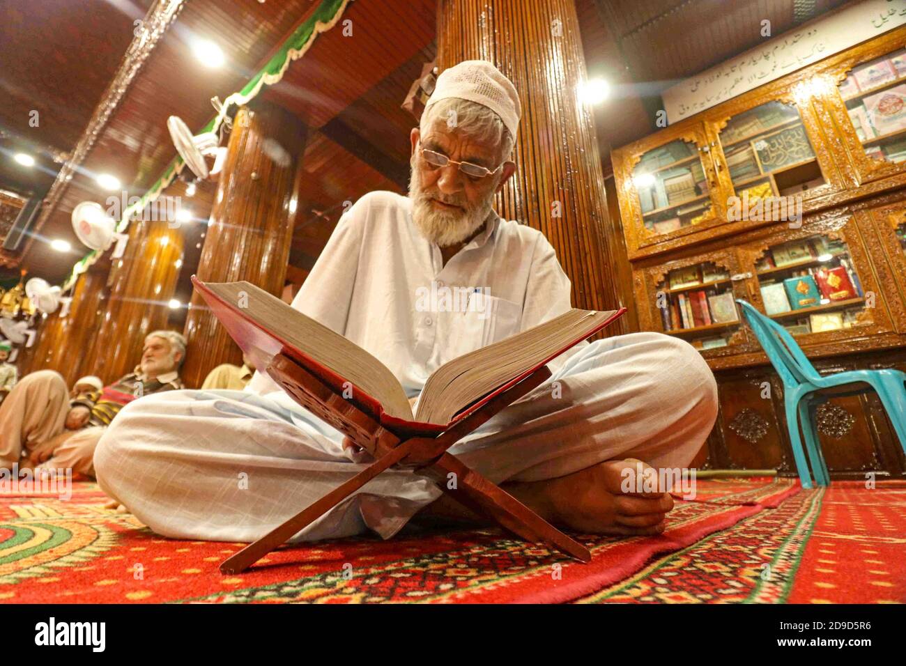 A man reading the Quran and praying. kashmir, India Stock Photo Alamy