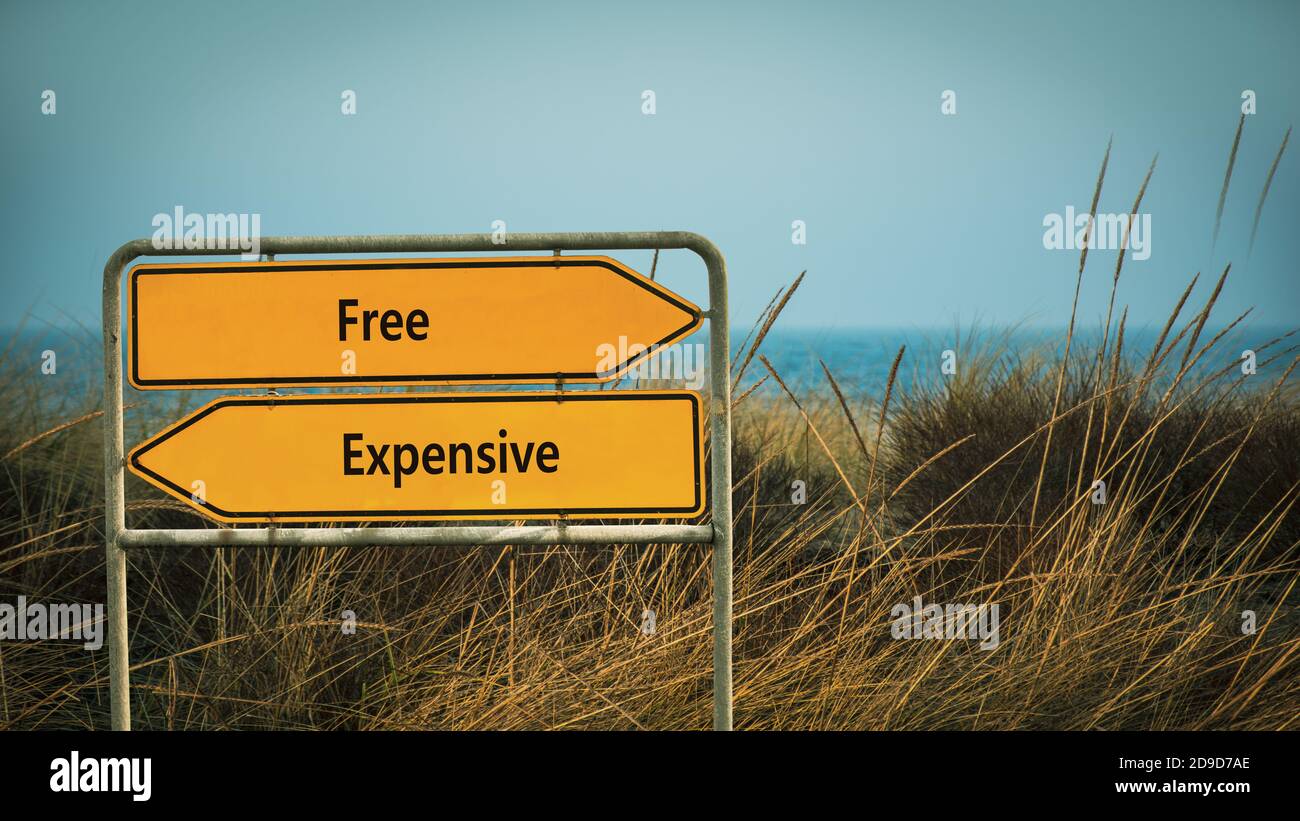 Street Sign the Direction Way to Free versus Expensive Stock Photo - Alamy