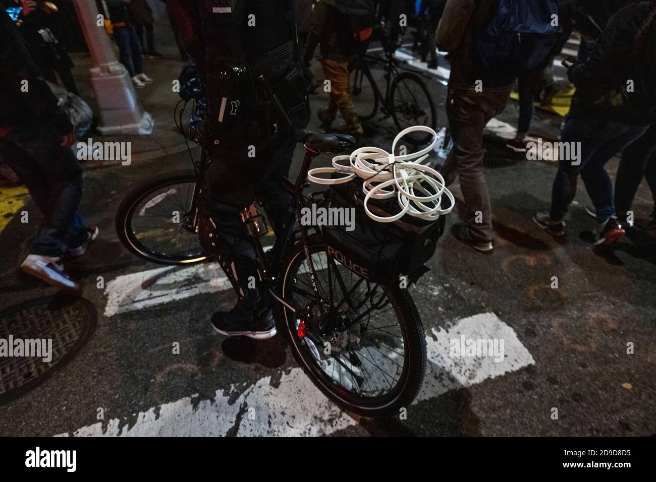 New York, New York, US. Nov 4th 2020. Plastic restraints on a police bicycle as several hundred anti-Trump protesters march through New York City's Greenwich Village neighborhood while the US awaits the results of its presidential election Stock Photo