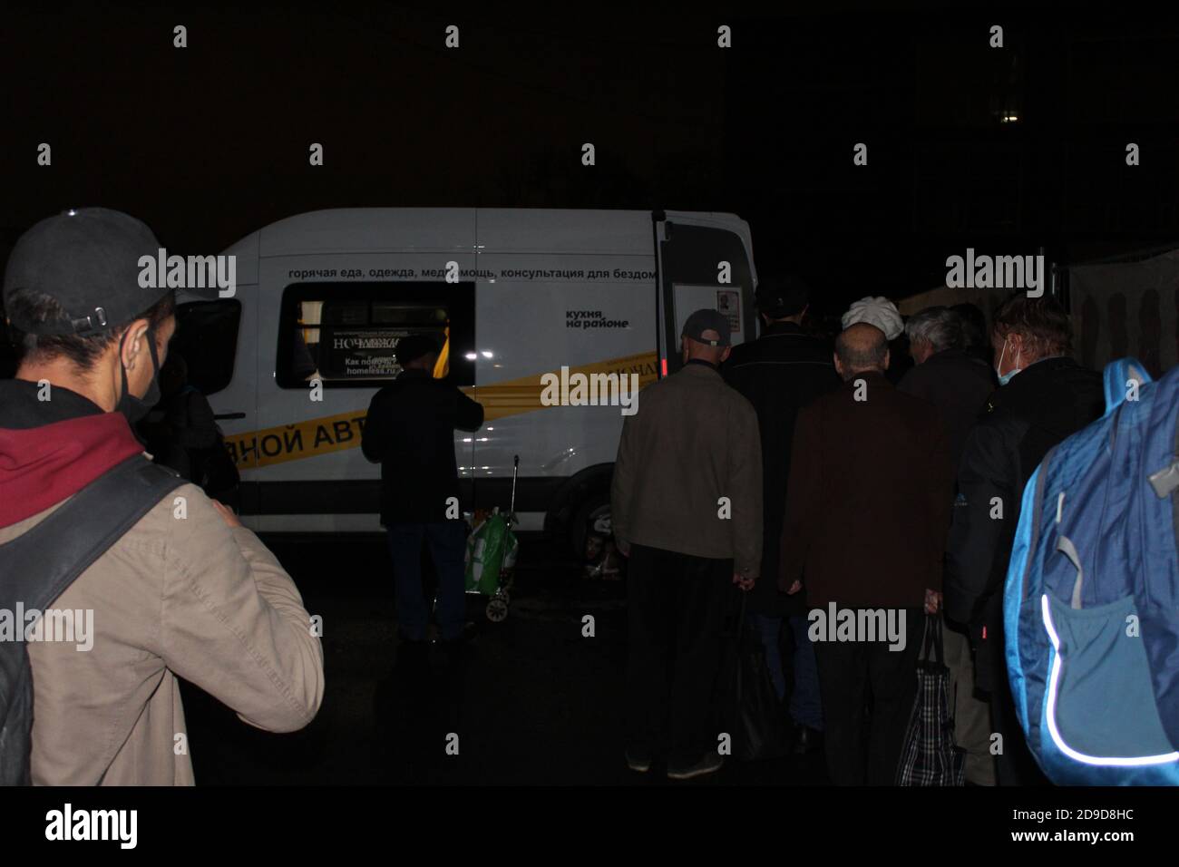 Moskau, Russia. 12th Oct, 2020. Hundreds of homeless people stand in front of a bus of the NGO Notschleschka at night and wait for food. Thousands of homeless people fight for their survival every day in harsh Moscow. The Corona crisis makes their situation even more precarious. But there is hope. (to dpa: 'Corona aggravates situation for homeless in Moscow') Credit: Claudia Thaler/dpa/Alamy Live News Stock Photo