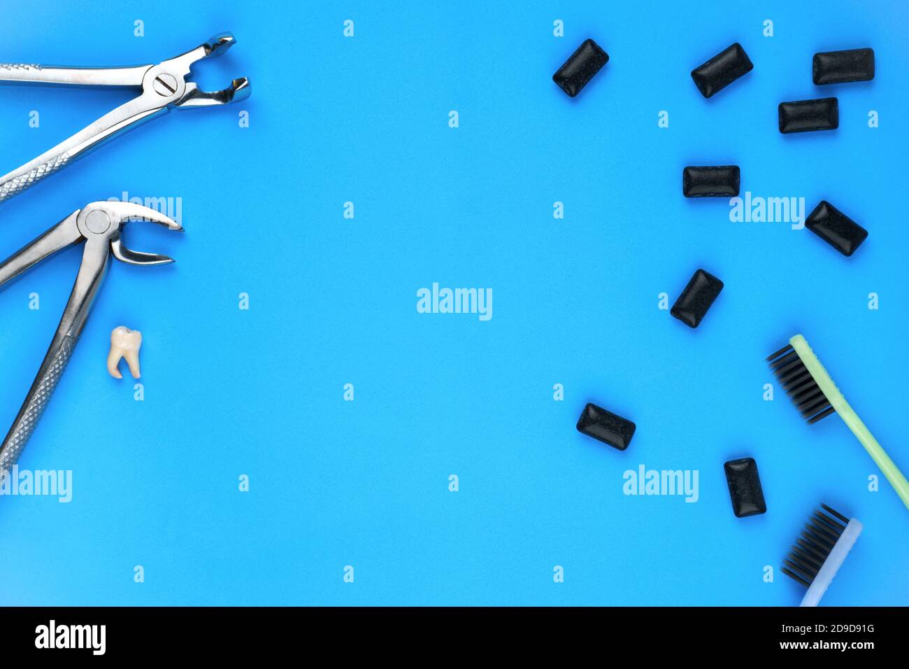 Photo of dental tools, removed tooth and black gum pads Stock Photo Alamy