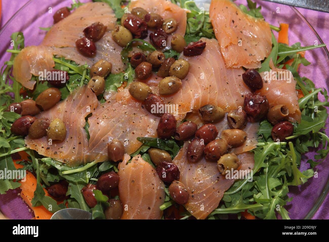 fish dishes: smoked salmon with olives Stock Photo