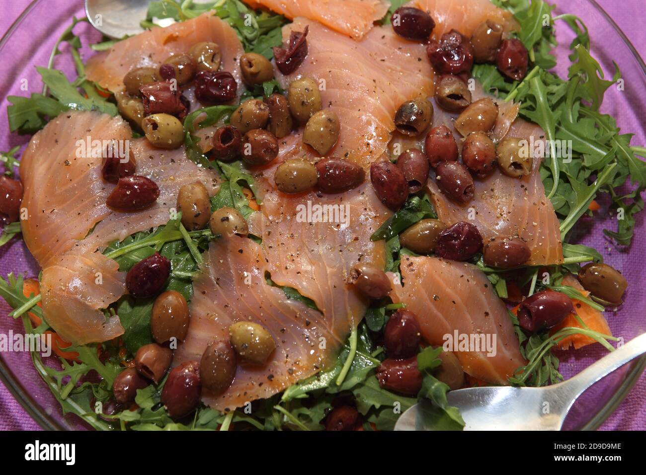 fish dishes: smoked salmon with olives Stock Photo