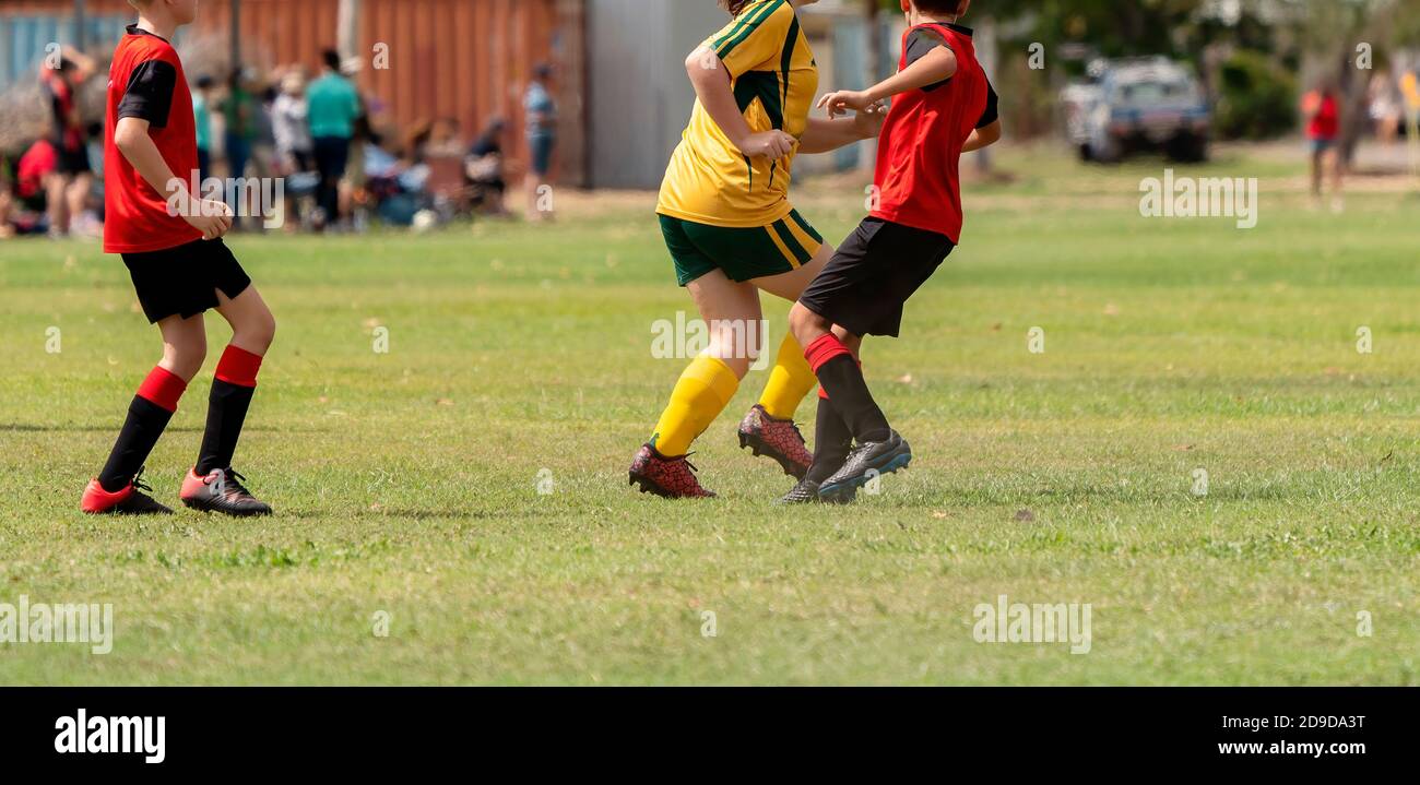 Young Soccer Players Chase The Ball On The Field During A Game Stock Photo Alamy Young Soccer Players Chase The Ball On The Field During A Game Stock Photo Alamy