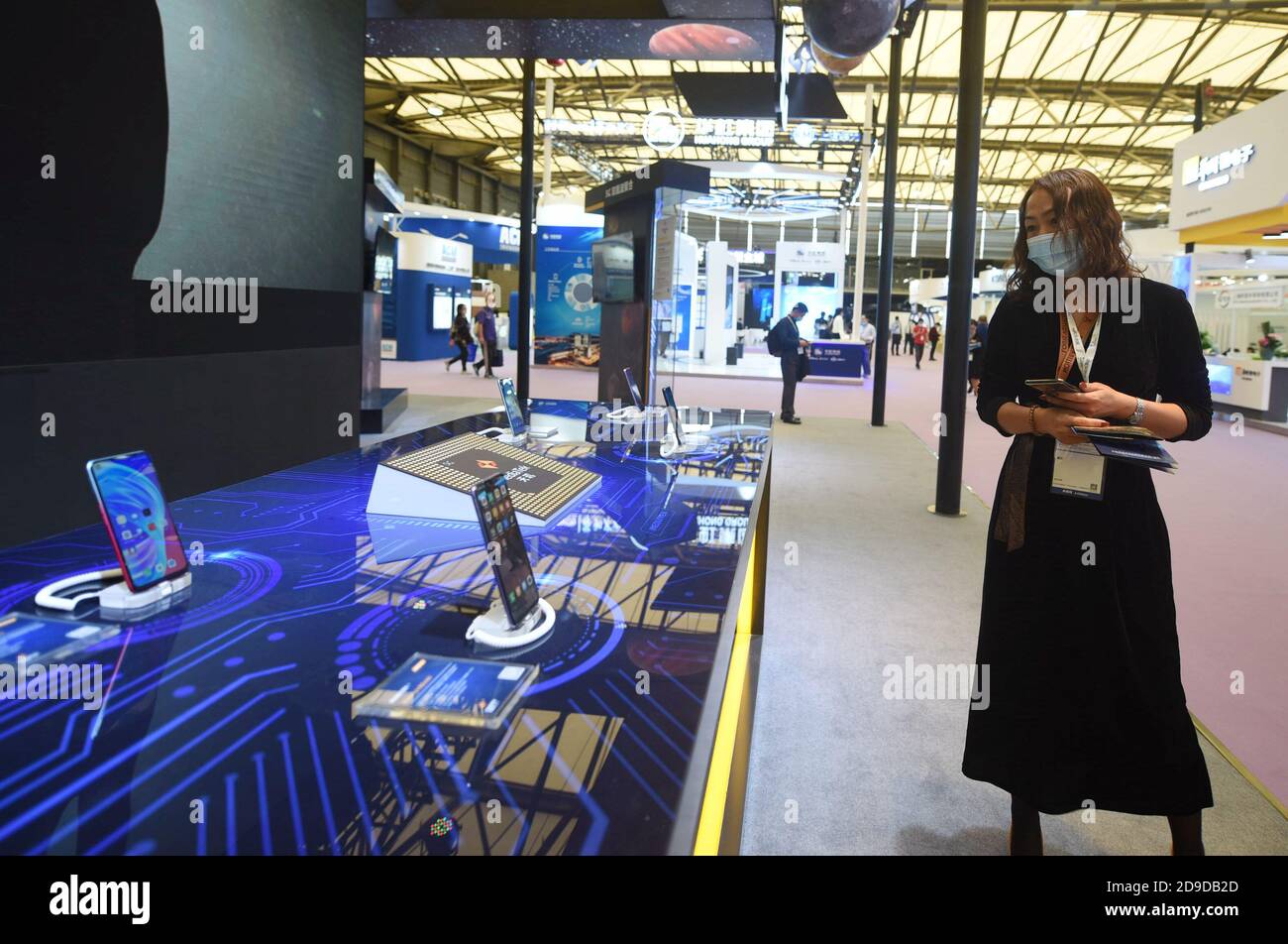 Visitors carefully observe various kinds of chips are exhibited at ...