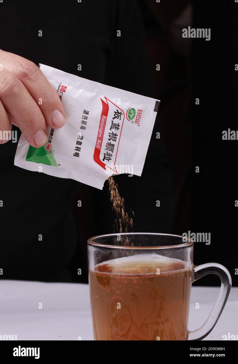 In this unlocated photo, a person pours a bag of Isatis Root, also known as Ban Lan Gen, which is widely used in China, 19 October 2020. *** Local Cap Stock Photo