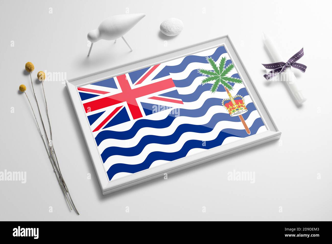 British Indian Ocean Territory flag in wooden frame on table. White natural soft concept, national celebration theme. Stock Photo