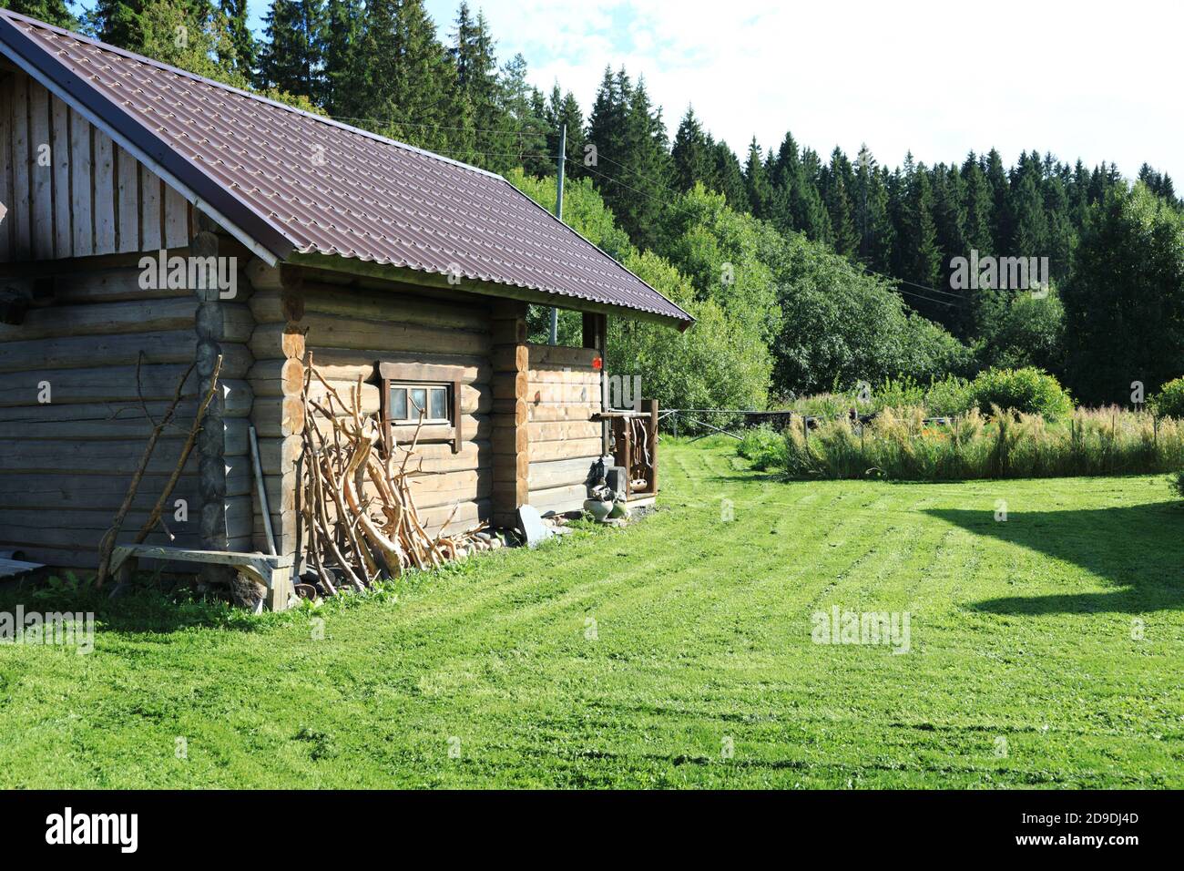 Russian wooden bathhouse at edge of forest, Karelia Stock Photo