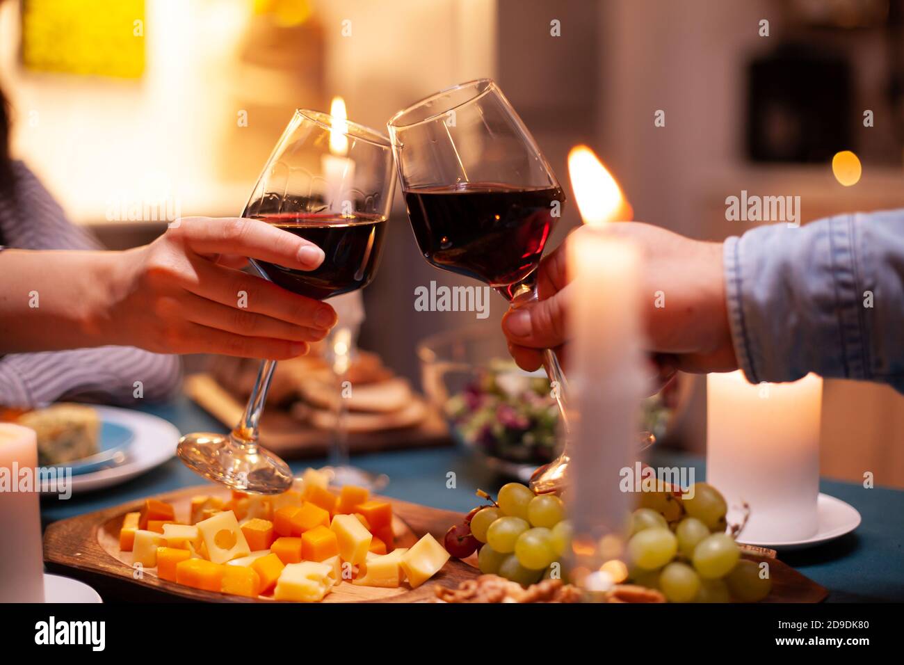 Romantic celebrating relationship toasting with red wine. Happy