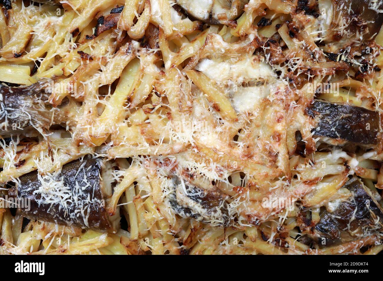 Baked rasp perch with potatoes on baking sheet Stock Photo - Alamy