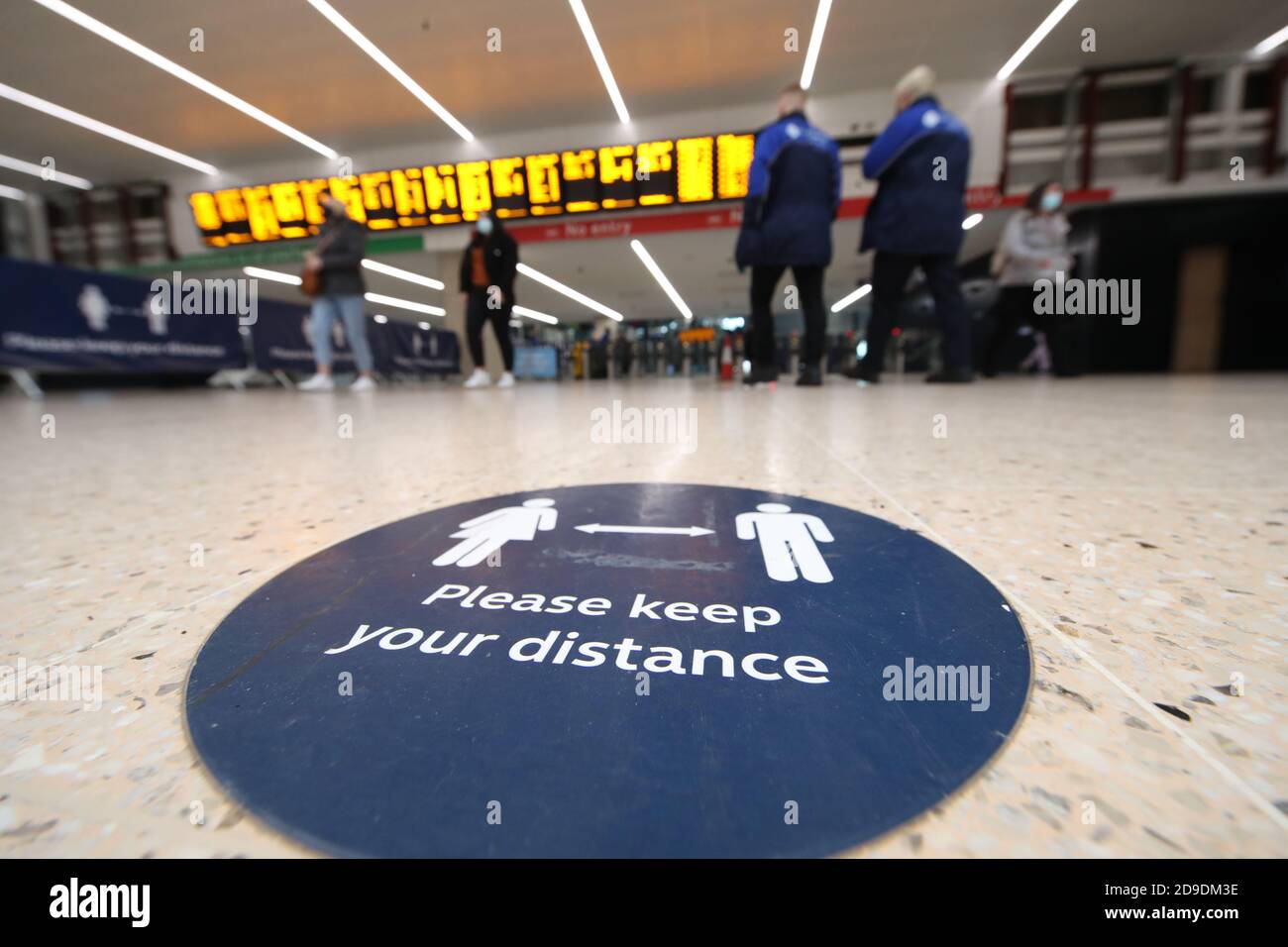 Social distance sign at Leeds train station at the start of a four week ...