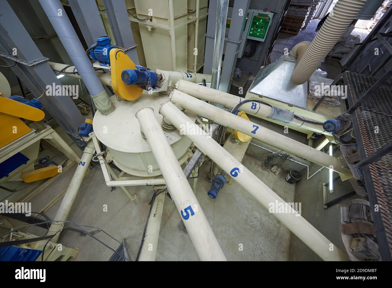 Equipment for mixing ingredients in an animal feed plant Stock Photo