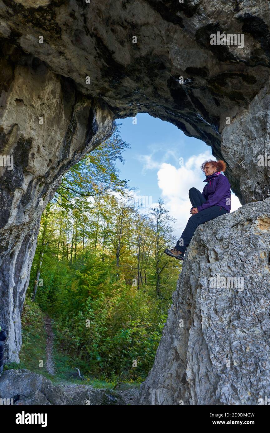 Woman hiker standing on the edge of a cliff in a doline Stock Photo - Alamy