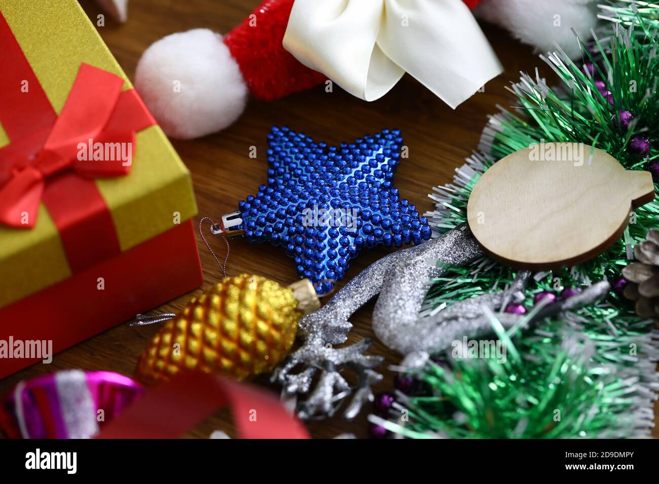 Christmas decorations and gift box lies on table. Stock Photo