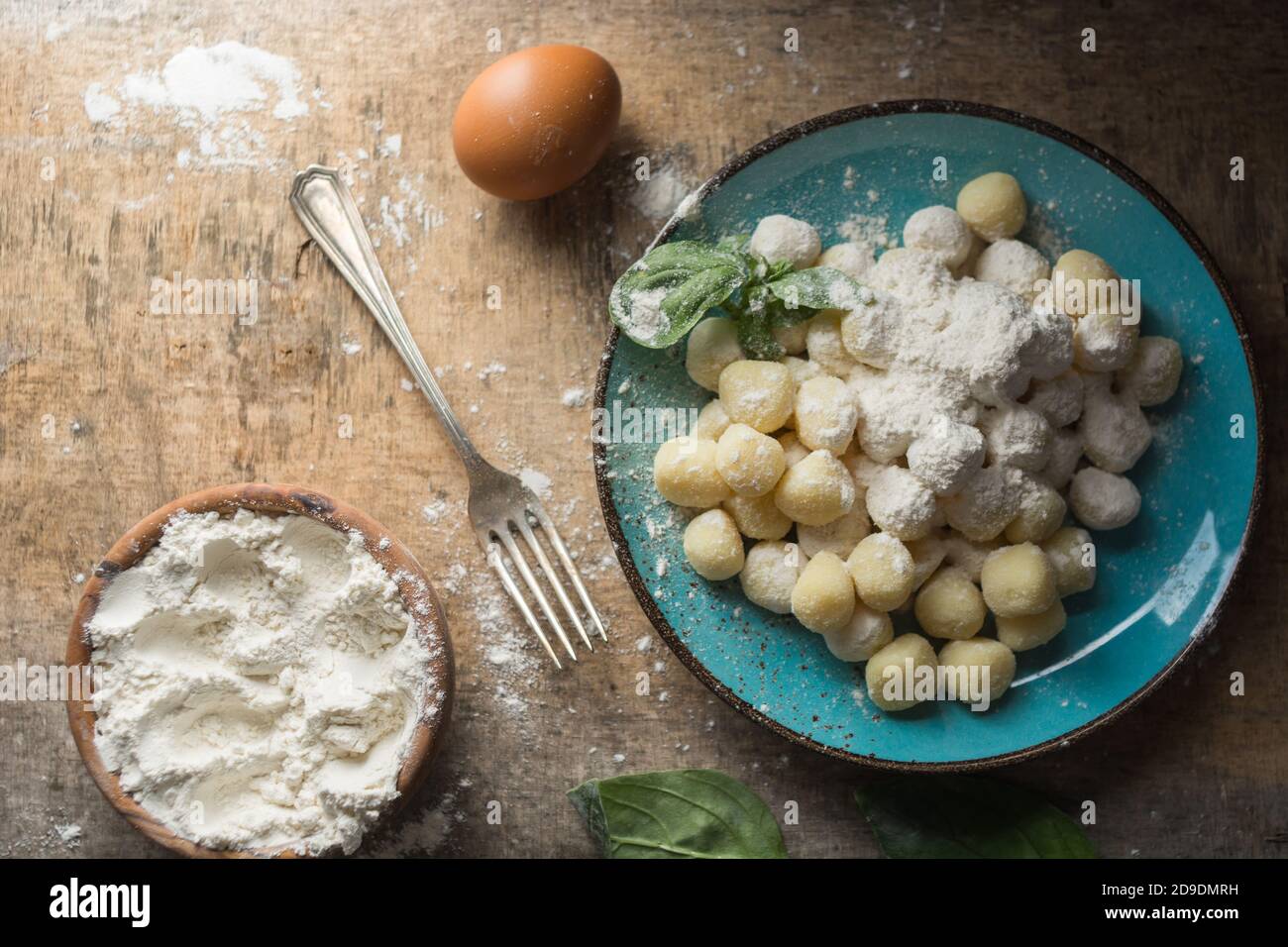 Raw gnocchi, typical Italian made of potato, flour and egg dish. Perfect meal to accompany with a sauce. Stock Photo