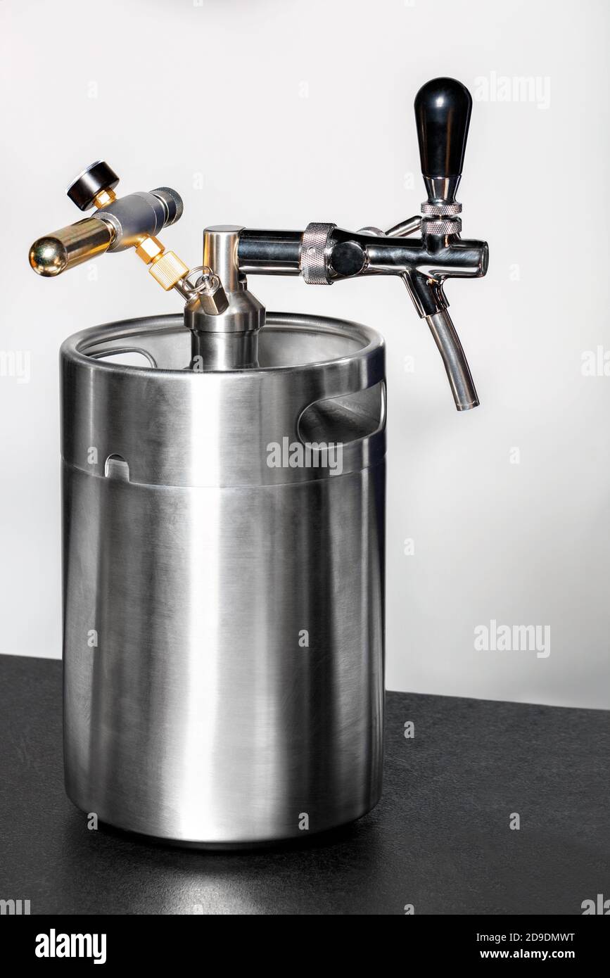 A new clean stainless steel barrel and a tap on it, copy space Stock