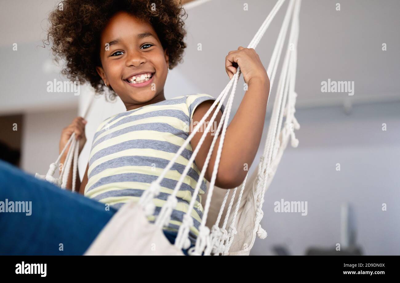 Happy playful preschool child girl having fun at home Stock Photo