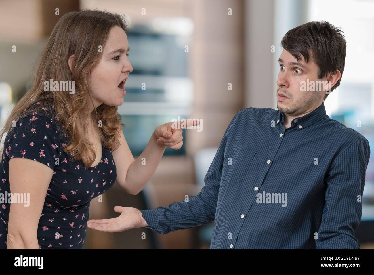 Jealousy hysterical wife is shouting and blaming her husband. Stock Photo