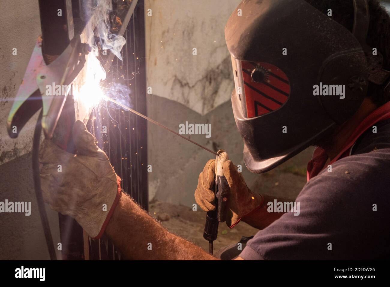 Man Using Wielding Machine Male welder closeup welding hi-res stock photography and images - Alamy